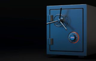 Black safe with round handle and digital combination lock with red backlight and message that says error